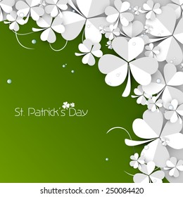 Beautiful white paper folded clover leaves on green background for Happy St. Patrick's Day celebration.