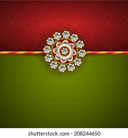 Beautiful white pearl decorated Rakhi on maroon and green background for Raksha Bandhan festival celebrations. 