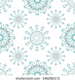 Beautiful winter design with teal and silver stylised snowflakes. Seamless vector pattern on white background. For textiles, Christmas cards and giftwrap, party invitations, flyers, graphic design uses.