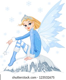 Beautiful Winter fairy sitting on ice rock