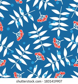 Beautiful winter seamless pattern with red Rowan berries, white leafs silhouettes and snowflakes on blue background. Cute botanical vintage ornament for textile, wrapping paper, wallpapers.