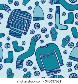 Beautiful winter vector set. Warm clothing. Pullover, cap, scarf, mittens, socks, boots.