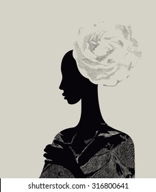 Beautiful woman with abstract flower hair-do
