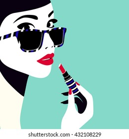 Beautiful woman applying lipstick. High fashion, vogue style