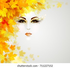 Beautiful woman in autumn circle of leaves