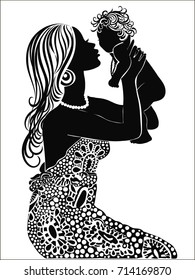 Beautiful woman with baby. Silhouette of a woman with a baby.