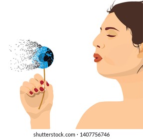 Beautiful woman blowing a dandelion in the form of a globe