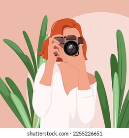 A beautiful woman with a camera. Photographer.