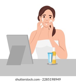 Beautiful woman cares for her facial skin. Girl wearing a towel applies cream to her face. Self-care concept. Morning routine. Lady with a jar of cream in hands. Flat vector 