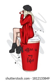 A beautiful woman in a coat, boots and a beret sits on a large glass of coffee. Fashion and style, clothing and accessories.