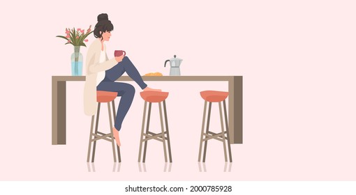 beautiful woman drinking coffee girl sitting on stool at kitchen counter full length horizontal