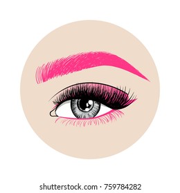 Beautiful woman eye with creative makeup. Pink eyebrow, long pink eyelashes and unusual makeup with pink shadows. Fashion eye on a beige circle. 