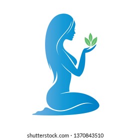beautiful woman holding a plant ina a palm, heath care concept