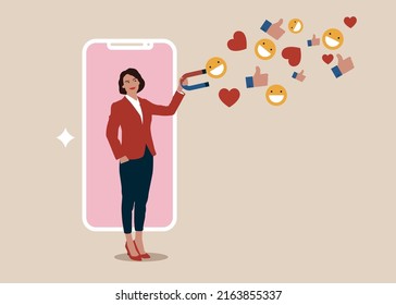 Beautiful woman lady stand out from mobile smartphone using magnet to draw social media emoji interaction. Influencer marketing, digital social media for marketing campaign or advertising concept.