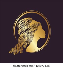 Beautiful woman portrait with elegant curly hairstyle in metallic gold color.Greek goddess cameo illustration.Beauty, style and hair salon logo isolated on dark background.