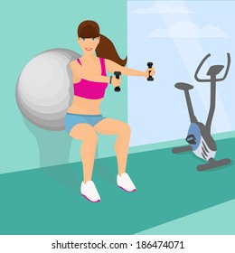 Beautiful woman squats using fitness ball with dumbbells in her hands (horizontal position)