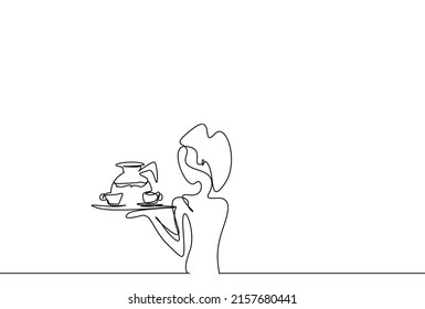 a beautiful woman at work holding tray and drinking glasses