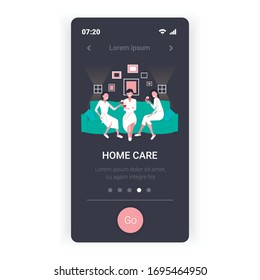 beautiful women in bathrobes drinking wine having fun home care concept girls sitting on sofa relaxing during bachelorette party smartphone screen mobile app full length copy space vector illustration