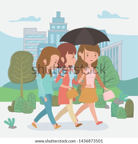 beautiful women walking in the park using smartphones