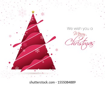 Beautiful Xmas tree made by paper-cut, decorated with golden star and snowflakes. Merry Christmas celebrations concept.