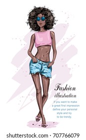 Beautiful young African American woman with an afro hairstyle. Fashion woman. Hand drawn black skin girl. Sketch. Vector illustration.