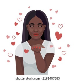 Beautiful young african woman blows a kiss.