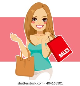 Beautiful young blonde woman shopping sales holding red bag and purse