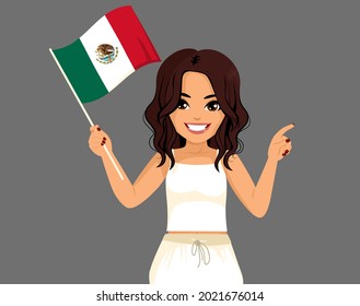 Beautiful young brunette Mexican happy woman smiling holding Mexico flag