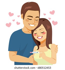 Beautiful young couple happy with positive pregnancy test result