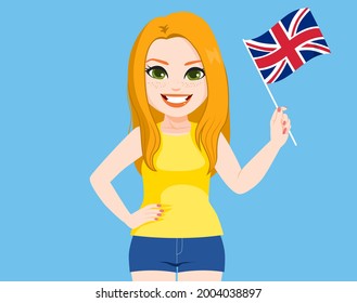 Beautiful young English woman holding Great Britain Flag