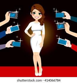 Beautiful young famous woman posing on red carpet for paparazzi photographing with cameras and smartphones