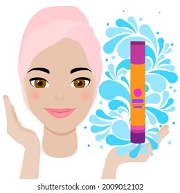 Beautiful young female model shows spa cosmetic product on the open palm of her hand.  Splash of blue water drops. The face of a lovely smiling beauty girl with clean fresh healthy skin. 