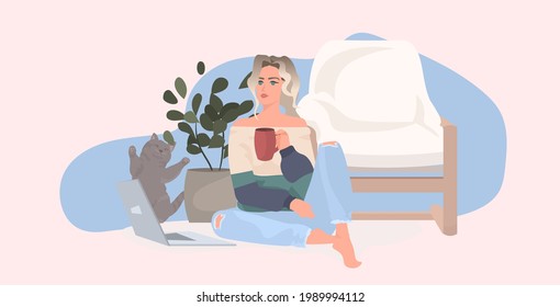 beautiful young girl drinking coffee and working on laptop woman sitting on floor with cat