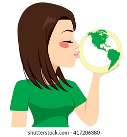 Beautiful young girl kissing green earth globe for recycling concept
