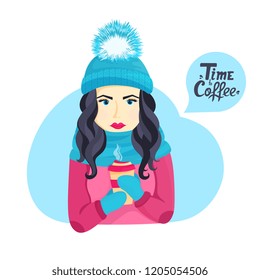 Beautiful young girl in a winter hat with a fluffy pompon and in a scarf holding a cup of hot coffee.