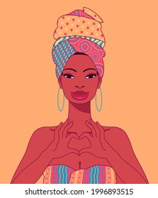 Beautiful young happy black woman with head wrap and print dress making heart with hands. Cartoon style portrait of African woman in traditional dress.