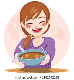 Beautiful young happy woman serving healthy stew bowl