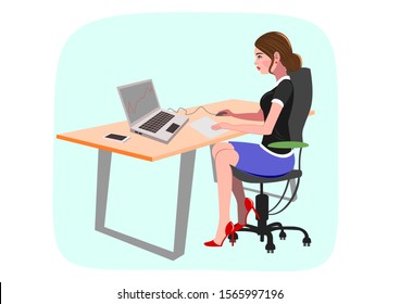 Beautiful young lady sitting at desk and working on her lap top.