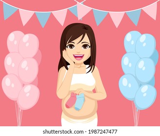 Beautiful young mother with pink and blue socks on baby shower gender reveal party