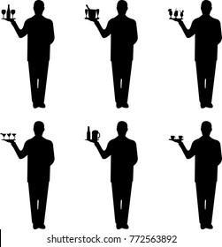 Beautiful young waiter standing and holding a round tray with different drinks silhouette, one in the series of similar images