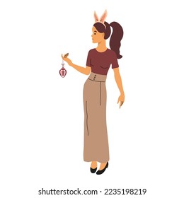 Beautiful young woman in bunny ears holding a Christmas toy. Traditional winter holiday celebration. Merry Christmas and Happy New Year
