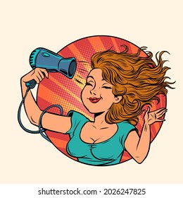 beautiful young woman dries her hair with a hair dryer. Hygiene equipment