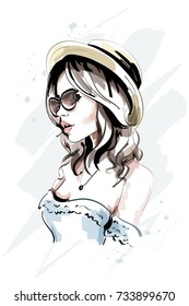 Beautiful young woman in hat. Stylish hand drawn woman in sunglasses. Fashion lady. Sketch.