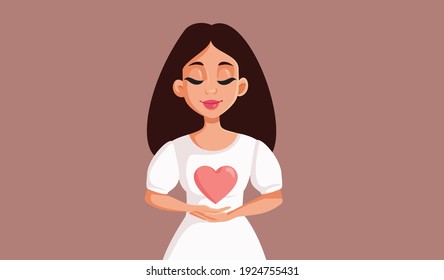 Beautiful Young Woman Holding Heart Symbol. Happy person feeling grateful having compassion
