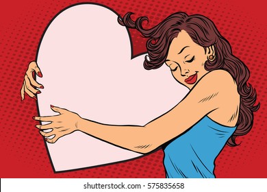 Beautiful young woman hugging Valentine heart