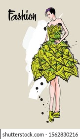 Beautiful young woman in lime evening dress. Hand drawn fashion girl. Fashion model posing. Sketch. Vector illustration of a girl in dance in an evening dress.