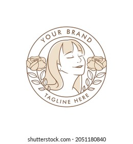 Beautiful young woman with long hair and natural flowers. Cosmetics and hair salon vector badge logo isolated on white background.