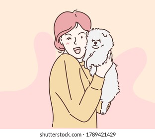 Beautiful young woman playing with her little dog. Hand drawn in thin line style of happy pet lover with dog.  Vector illustrations.