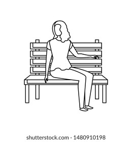 beautiful and young woman seated in park chair