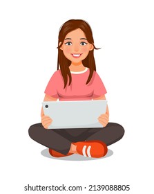 beautiful young woman sitting on the floor while using a digital smart tablet device for reading news, browsing Internet, watching videos and checking social networks